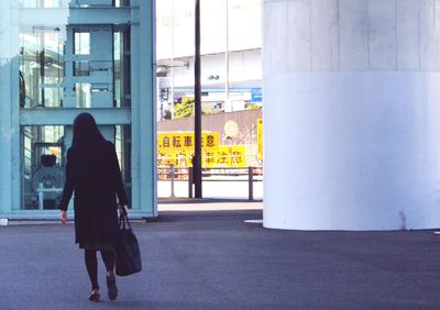 Full length of woman standing in city