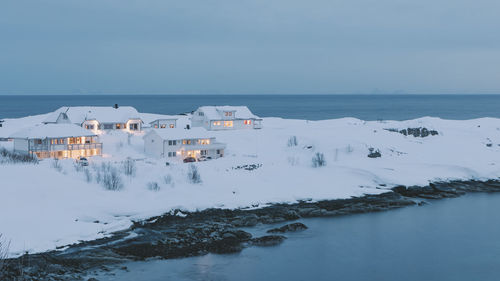 Scenic view of sea and buildings against sky