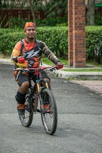 Man riding motorcycle on road