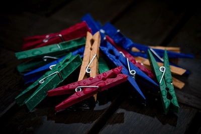 Close-up of wet colorful clothespins on table