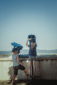 Two children looking at view