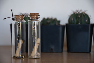 Close-up of wine bottles on table