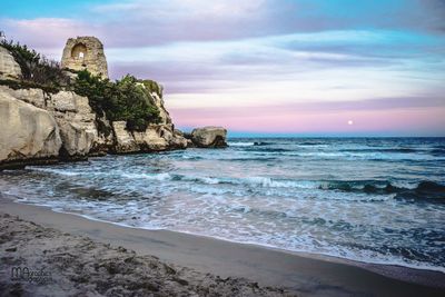 Scenic view of sea against cloudy sky