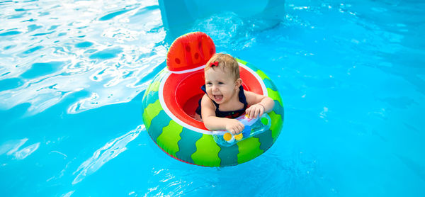 High angle view of woman swimming in sea