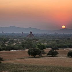 Scenic view of landscape at sunset