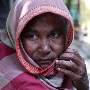 Portrait of woman with red mask