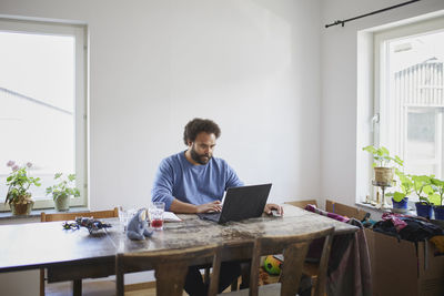 Man working on laptop from home