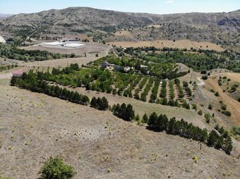 High angle view of agricultural field against mountains