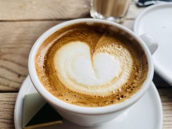 Close-up of cappuccino on table