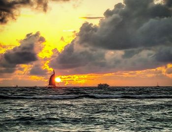 Scenic view of sea against cloudy sky