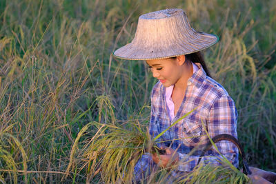 Woman wearing hat on field