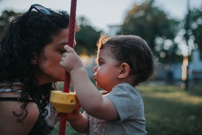 Side view of mother and son