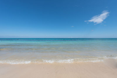 Scenic view of sea against blue sky