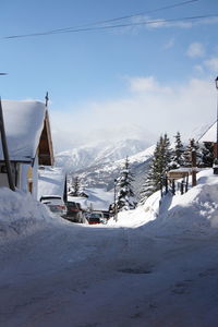 Scenic view of snow covered mountains against sky