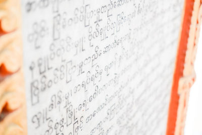 High angle view of burmese writing on a wall.