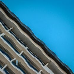 Low angle view of tree against clear blue sky