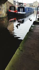 Boats moored in water