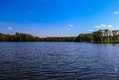 Scenic view of lake against blue sky