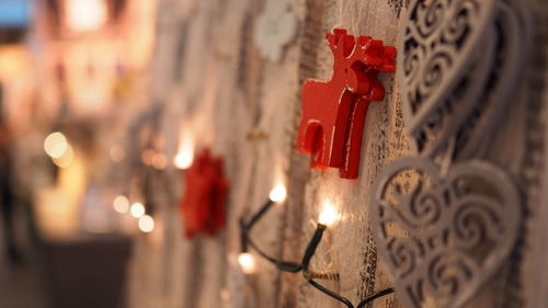 Close-up of illuminated candles in temple