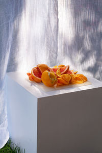 A serving of sliced citrus fruits on tray