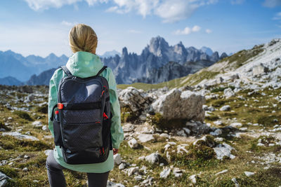 Rear view of senior man against mountains against sky