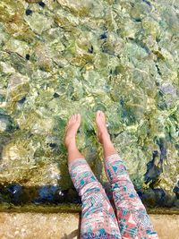 Low section of woman on rock