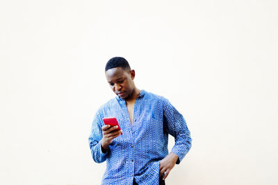 Young african man using his smartphone