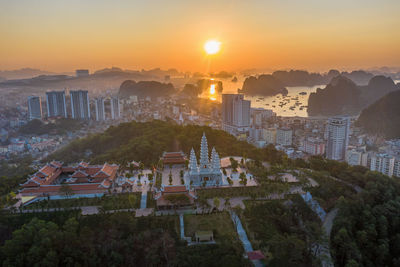 High angle view of buildings against sky during sunset