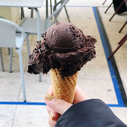 Midsection of woman holding ice cream