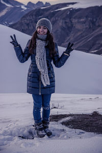 Full length of woman standing on rock