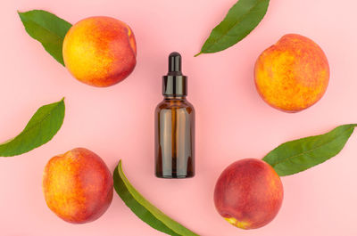 Natural peach oil. natural cosmetics, hair care. bottle with essential peach oil