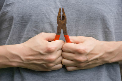 Midsection of man holding key
