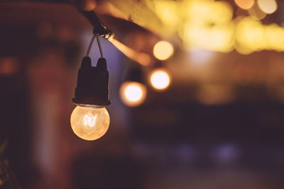 Close-up of illuminated light bulb