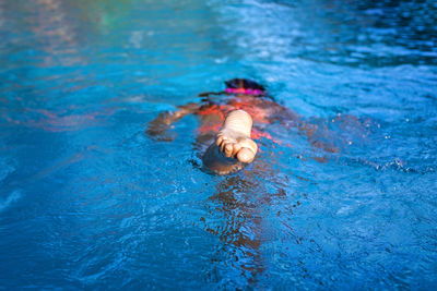 High angle view of man swimming in pool