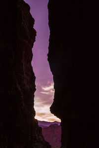 Low angle view of rock formation against sky at sunset