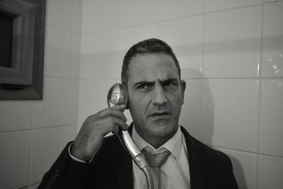 Man holding shower head