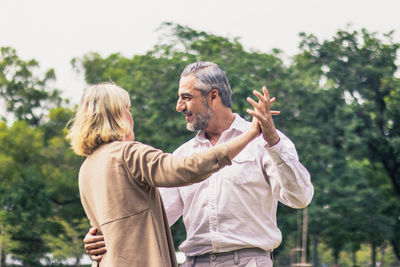 Couple dancing outdoors