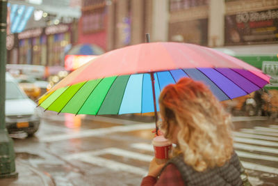Close-up of woman holding umbrella