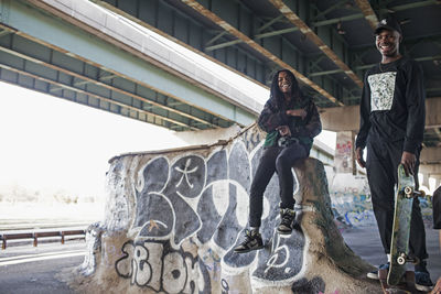 Two young men at a skateboard park.