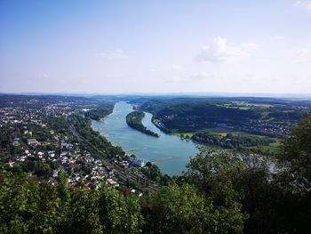 High angle view of river amidst city against sky