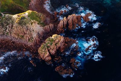 High angle view of rocks in sea