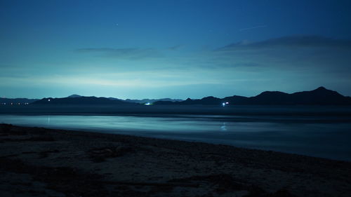 Scenic view of sea against sky at dusk