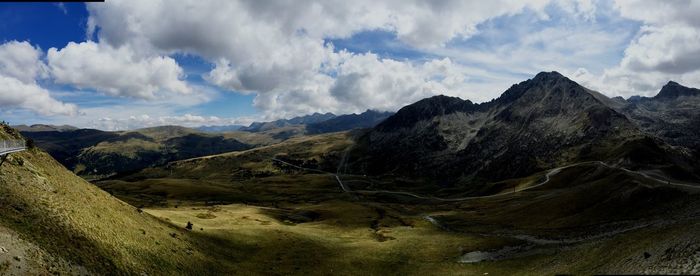 Scenic view of mountains against cloudy sky