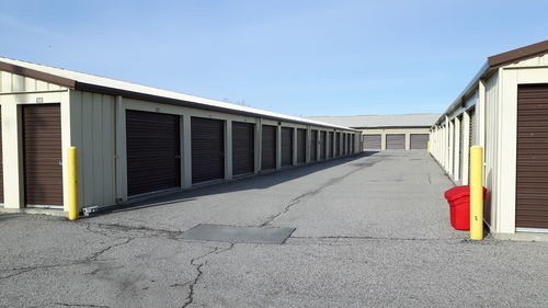 Exterior of warehouses against clear sky