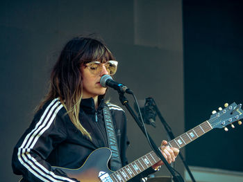 Young woman playing guitar