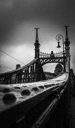 View of bridge against cloudy sky