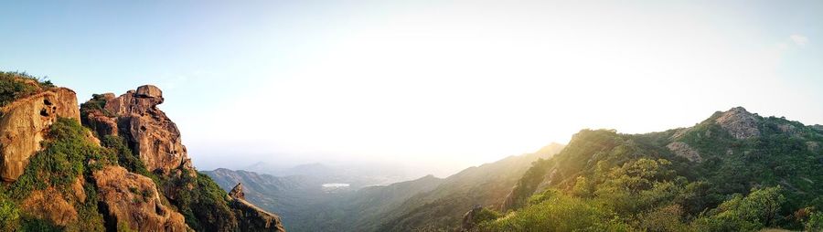 Panoramic view of mountains against clear sky