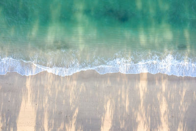 Scenic view of sea waves splashing on shore