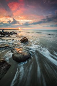 Scenic view of sea against sky during sunset