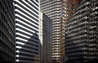 Full frame shot of modern office buildings in city